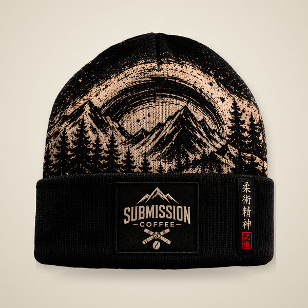 Submission Coffee beanie, front view, black cuffed beanie with tan mountain artwork and Submission Coffee patch
