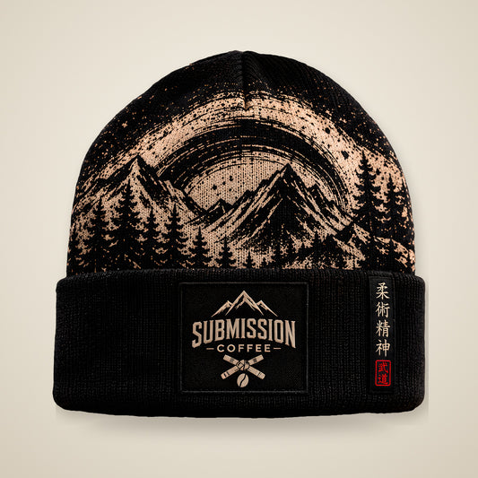 Submission Coffee beanie, front view, black cuffed beanie with tan mountain artwork and Submission Coffee patch